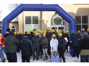 Participants in the Coldest Night of the Year, YWCA Regina's family-friendly winter fundraiser, gather near St. Paul's Cathedral in downtown Regina on Saturday, February 26, 2022. The fundraiser, returned this year with a hybrid event. Participants could walk virtually or in person, with Saturday's two or five-kilometre walk in the downtown to raise awareness and funds for women and families facing homelessness.