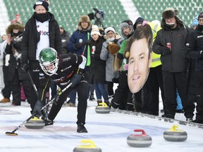 Calgary's Kevin Koe (back) looks on while Regina's Matt Dunstone works a rock into the house during a Skins Game held at Mosaic Stadium as part of the first Frost Festival. The large photo is of Kirk Muyres, Dunstone's second with the Highland-based team. Dunstone won the Skins Game, collecting $21,500 of the $25,000 prize money. Photo courtesy Regina Exhibition Association Limited.