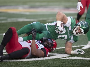 Darnell Sankey, shown tackling Saskatchewan Roughriders fullback Alexandre Dupuis as a member of the Calgary Stampeders last season, has signed with the Green and White.