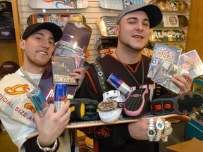 This 2004 photo shows Dustin Porter (left) and Andrew Hincks at the former 306 Hip Hop Sk8shop in the Northgate Mall, holding some of the merchandise sold at the shop.