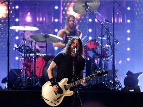 Dave Grohl and Taylor Hawkins of the Foo Fighters perform after the band was inducted into the Rock and Roll Hall of Fame, in Cleveland, Ohio on October 30, 2021.