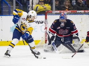 Saskatoon Blades forward Jayden Wiens tries to beat Regina Pats goalie Drew Sim during Friday's WHL game at the SaskTel Centre. Sim sparkled during a 41- save performance, but a lack of offensive support was the Pats' undoing.