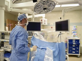 A surgeon demonstrates a surgery in an operating room at the Regina general Hospital in 2017.
