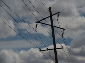 Power lines intersect the sky on Fleet Street in Regina, Saskatchewan on May 1, 2020.