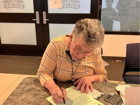 Beatrice Brossart, 87, files a police report on Feb. 25, 2022 after losing $5,000 to a scammer who convinced her to pay a fake pending $6,000 charge through gift cards. (Photo provided by Lynette Brossart)