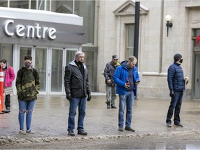 People outside a downtown mall in Regina on Feb. 28, the day the province lifted mask mandates.