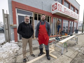 Butcher Boy Meats co-owners Jeff Fritzsche, left, and Gordon Herne stand outside their damaged store on Thursday, March 3, 2022 in Regina.