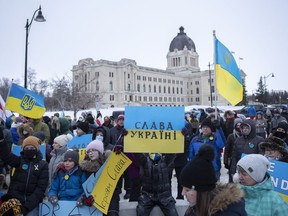 Protesters with the "Stand With Ukraine" movement who are against the current invasion of Ukraine by Russia rally outside the Saskatchewan Legislative Building on Thursday.