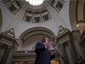 Premier of Saskatchewan Scott Moe answers questions from the media inside the Saskatchewan Legislative Building after session on Monday.