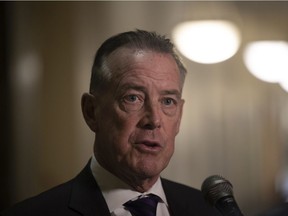 Government Relations Minister Don McMorris speaks to the press during the spring 2022 sitting.
