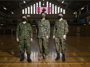 Pte Gabrielle
Ravelo, from left, Sgt. Inga Hammer and  Cpl Sara Liesch inside the Regina Armoury on Monday, March 14, 2022 in Regina.