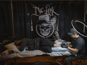 Zach Loughran gets inked by DC Ink Studio during the Pile O Bones tattoo convention at the Turvey Centre on Saturday, March 19, 2022 in Regina.