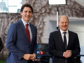 German Chancellor Olaf Scholz (right) greets Canadian Prime Minister Justin Trudeau as he arrives at the Chancellery in Berlin for talks on Wednesday, March 9, 2022.