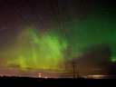 The sky near Crossfield, Alberta.  north of Calgary illuminated by the Northern Lights in April 2015.