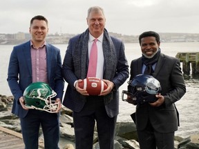 Left to right: Saskatchewan Roughriders kicker Brett Lauther, CFL commissioner Randy Ambrosie and Toronto Argonauts general manager Michael (Pinball) Clemons are shown in Wolfville, N.S., where Touchdown Atlantic is to be played July 16.