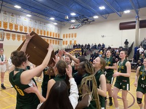 The Campbell Tartans celebrate on Saturday after defeating the Saskatoon St. Joseph Guardians 76-74 in overtime at Dr. Martin LeBoldus Catholic High School to win the 5A girls title at Hoopla — the Saskatchewan High Schools Athletic Association basketball championships.