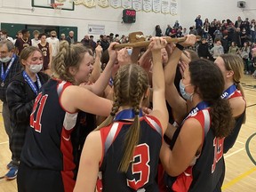 Members of the Miller Marauders celebrate after defeating the Riffel Royals 60-50 in the Regina Intercollegiate Basketball League's junior girls Blue Division final on Friday at Campbell Collegiate.
