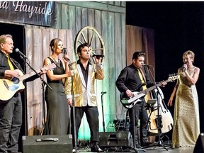 Gil Risling (from left), Andrea Anderson, Vic deSousa, Derek Pulliam and Lori Risling on stage for the Louisiana Hayride.