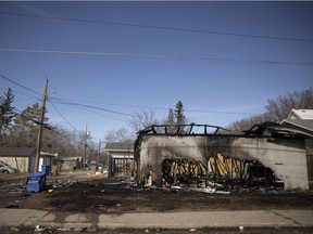 The remnants of a garage fire stand on a property on the corner of Garnet and 8th avenue on April 4, 2022 in Regina. Regina police charged an 18-year-old woman with arson in connection with this fire and two others set within a few hours the same day. Police and fire crews were first called this blaze around 12:45 p.m. on April 4, 2022, followed by two others, at 3:30 p.m. on the 1100 block of Rae Street, and 4:45 p.m. on the 1000 block of Rae Street. There were no reports of any serious physical injuries.