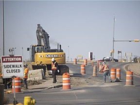 Construction crews work on a overpass on Winnipeg street that directs traffic over Ring Road north back in April 2022.