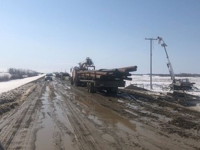 SaskPower crews working to restore power to the province's southeast after spring storms are contending with water-logged, mucky roads.