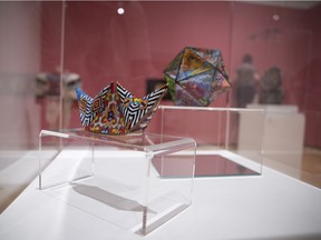 A piece by Nico Williams that is part of the installation entitled Radical Stitch.  The case is pictured at the MacKenzie Art Gallery, which is now open to the public.
