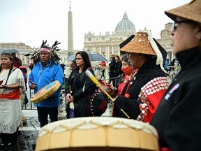 Delegation members chant on March 31, 2022 at St. Peter's square in The Vatican, within a meeting of delegates of Canada's Assembly of Firsts Nations (AFN) with the Pope, as part of a series of a week-long meetings of Canada's Indigenous elders, leaders, survivors and youth at the Vatican.