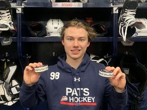 Connor Bedard of the Regina Pats celebrates after hitting the 50-goal and 100-point milestones  in the same game — Sunday's 7-4 victory over the Moose Jaw Warriors at the Brandt Centre.