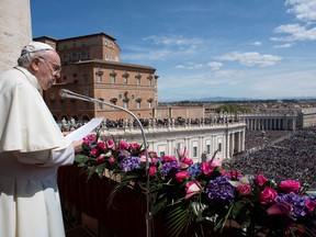 Pope Francis delivers his "Urbi et Orbi" ("To the City and the World") message from the balcony overlooking St. Peter's Square, on Easter Sunday, at the Vatican April 17, 2022.