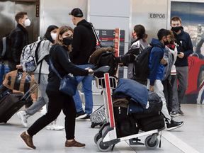 Travellers at Pearson International Airport on March 11, 2022.