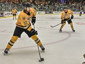 Erik Houk, left, of the host Estevan Bruins scored three goals against the Red Lake Miners at the Centennial Cup on Monday at Affinity Place.
