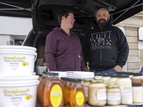 Sasha Howland, left, and Danny Wasylenchuk, right, of Howland’s Honey are happy to be back, as the third-generation business is a long-running regular with the market.