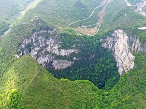 Dashiwei Tiankeng, a giant sinkhole in China's Guangxi region.