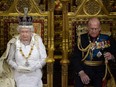 In this photo taken on June 4, 2014, Queen Elizabeth II delivers the Queen's Speech from the Throne in the House of Lords next to Prince Philip, Duke of Edinburgh (R) during the State Opening of Parliament at the Palace of Westminster in London.