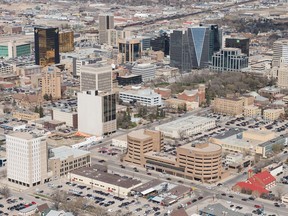 An aerial photo shows Regina's downtown including the Hill Towers, the SGI building, the Court of Queen's Bench, the Hotel Saskatchewan, the Capital Pointe hole and other city landmarks.