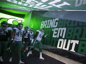 The Saskatchewan Roughriders run onto the field during the first half of CFL action at Mosaic Stadium during the exhibition game between the Saskatchewan Roughriders and Winnipeg Blue Bombers on Tuesday, May 31, 2022 in Regina.