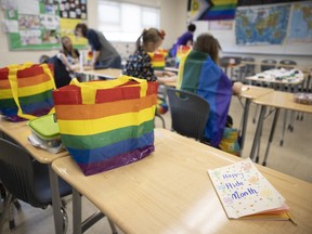 A homemade card that says. "Happy Pride Month" sits in a class room where students are making crafts at the Prairie Valley Gay Straight Alliance Summit.