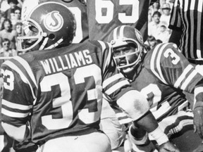 Fred Williams, 33, celebrates after scoring his first of two touchdowns Aug. 28, 1977 against the Calgary Stampeders at Taylor Field. Also shown is fellow Roughriders running back Molly McGee, 32. Offensive lineman Sam Holden, 65, is partially obscured.