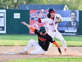 Regina Red Sox shortstop Zane Zielinski fires the ball to first as Brody Alexandre of the Swift Current 57's slides into second base Tuesday at Currie Field. The Red Sox won their home opener 6-0.