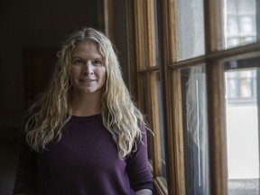 Gym owner Jolene de Vries stands for a portrait in the legislature after raising concerns about inflationary pressures to her business.