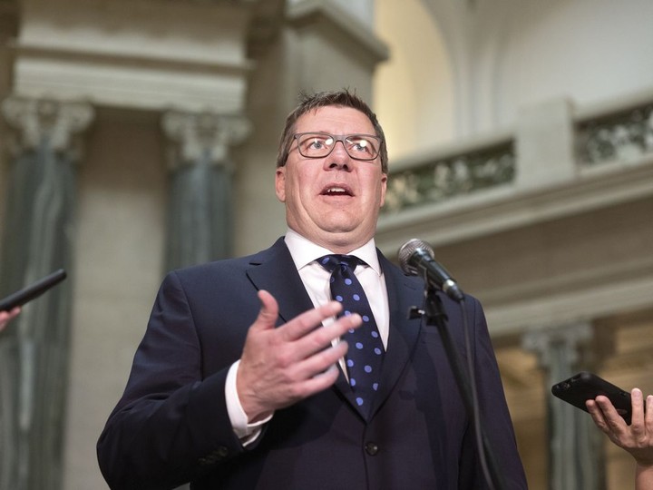  Premier Scott Moe speaks with reporters at the Legislative Building on Wednesday.