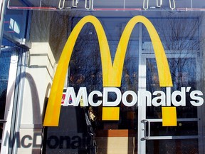 McDonald's logo is seen on the window of one of its restaurants in New York January 24, 2011.