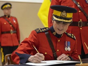 RCMP Saskatchewan's official Change of Command Ceremony at the RCMP Academy in Regina marks the "symbolic handover" of authority from outgoing Commanding Officer Mark Fisher to incoming Commanding Office Rhonda Blackmore. Blackmore signs the change of command documents.