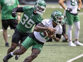 Saskatchewan Roughriders defensive back A.J. Hendy (35) covers receiver Paul McRoberts (88) during the Riders' 2021 training camp. Hendy is back with the Riders at their 2022 training camp.