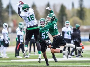 Justin McInnis, 18, goes high for a pass during the Saskatchewan Roughriders' training camp in Saskatoon.