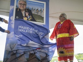 Chief Marie-Anne Day Walker-Pelletier stands by a newly unveiled stamp during an unveiling ceremony held by Canada Post for Chief Marie-Anne Day Walker-Pelletier who holds the title of the longest serving consecutive Fist Nations Chief in Canada on Wednesday, June 15, 2022 in Fort Qu'Appelle.
