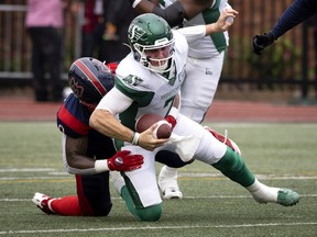 Saskatchewan Roughriders quarterback Cody Fajardo is sacked by Montreal Alouettes cornerback Mike Jones on Thursday night at Percival Molson Stadium.