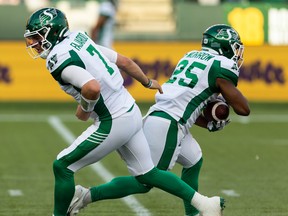 Cody Fajardo hands off to Jamal Morrow during Saturday's 26-16 victory over the Edmonton Elks — a game in which Morrow rushed for 126 yards.