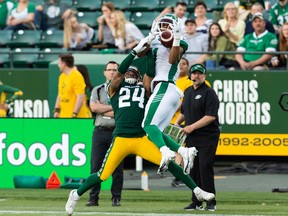 Saskatchewan Roughriders receiver Shaq Evans, 1, makes a leaping catch for a 36-yard gain against the host Edmonton Elks on June 18. Evans suffered a fractured ankle Thursday against the host Montreal Alouettes.