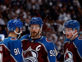 Jun 2, 2022; Denver, Colorado, USA; Colorado Avalanche left wing Gabriel Landeskog (92) talks with center Nazem Kadri (91) and defenseman Cale Makar (8) in the third period against the Edmonton Oilers in game two of the Western Conference Final of the 2022 Stanley Cup Playoffs at Ball Arena. Mandatory Credit: